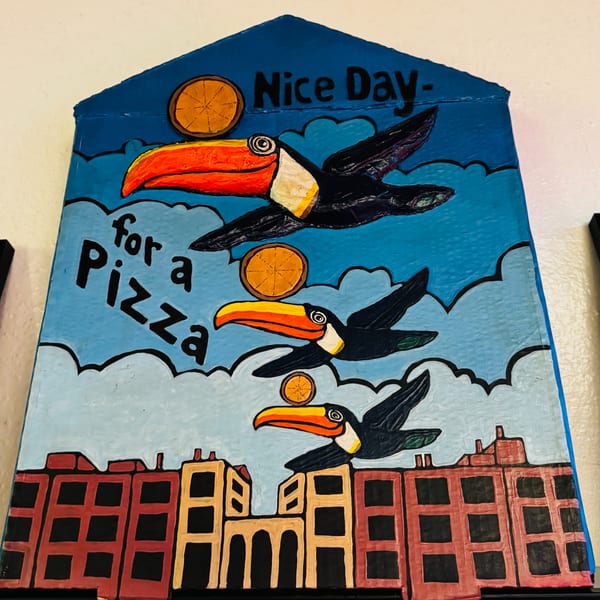 A colorful painting of toucans flying over buildings with text "Nice Day for a Pizza".